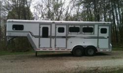 3 Horse GN for sale. Weekender with cabinets, fridge, microwave (not pictured...out for cleaning), walk through door to horse area. Escape door in first stall, stud divider, two roof vents per stall, vented tack room, SWING OUT SIDE TACK (can back