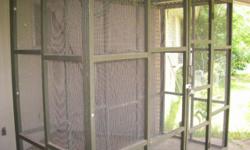 45" wide x 96" long x 85" tall aviary or large outdoor cage. All wood on floor is treated lumber. This aviary comes apart into six pieces for easy transporting or storage. Everything bolts together and is labeled for which piece goes where. Wire has very