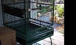 2 green powder coated bird cages. 32x28x36 5ft with stand. very good condition. complete with nest boxes and toys