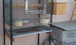 this is a tall bird cage for a nice bird to come in and have fun. its about 5 feet high. good size for amazons or cockatoos.includes food bowls only not any toys. call me at (818)-636-4340