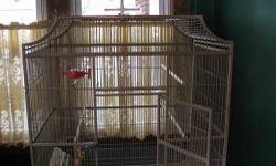 Kings flight cage 32w x 21d x 5'1h Inside height 34 inches. Two breeder doors. Top opens for a play area. Color is sandstone. Excellent condition. Asking $150.00
