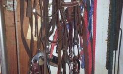 All the horse tack you will need..
2 Western Saddles
( Dark Brown is 15 1/2 inches)
( Light Brown one is 14 1/2 inches)
5 different sets of Reins
(Both leather and Nylon)
2 Halter lead rope sets
3 horse pads
1 lung line and whip
All of this Tack is in