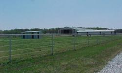 INDOOR ARENA 21 STALL HORSE FACILITY
Excellent horse boarding or training facility with indoor arena.Located 6 miles west of Sallisaw, Oklahoma, this 23 acre horse property has a 300 X60 ft horse barn with an extension off of it , that is 40 x 100 ft.