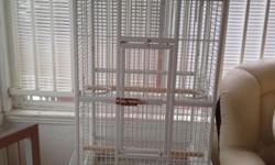 large parrot cage in excellent condition , has been used for only 4 months. i have 2 parrots , they used to live in separate cages but they are getting along well so they are living together in one cage now. so i have this extra cage for sale, the cage