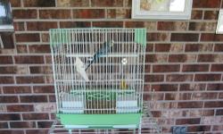 We have a year old blue male parakeet just in time for Father's Day. He is somewhat tame although he has not been hand-tamed yet. He is very active and curious.
Cage is 13 1/2" (L) x 11" (W) x 16" (H) Does NOT come with stand - used for taking picture