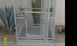 New parrot cage is domed top HQ Cage that opens on the top and has a drop down ledge and seed skirt/mess catcher... is a light gray color (Platinum) with gray and black flecks in it (powder coat) it 24 " across x 22 " deep x 64 " total height... 5/8 " bar